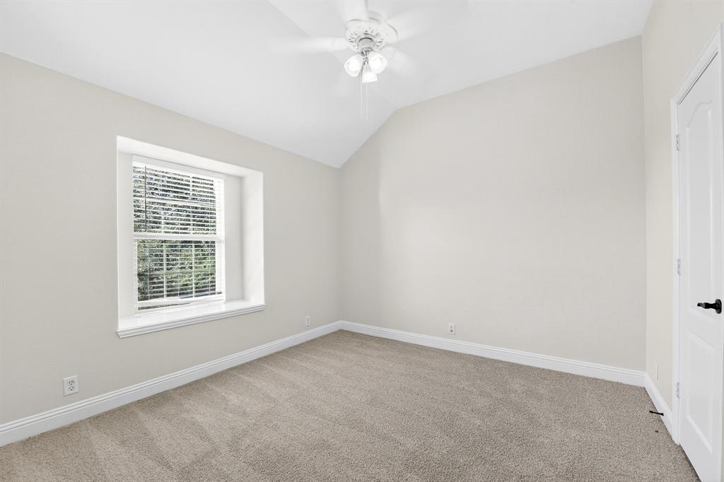 4308 Spruce Road Melissa, TX 75454 - Photo 31 of 39 an empty room with a window and a fan