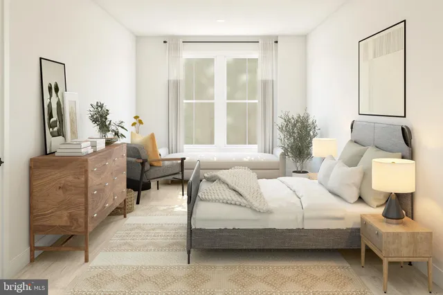 a bedroom with bed and window