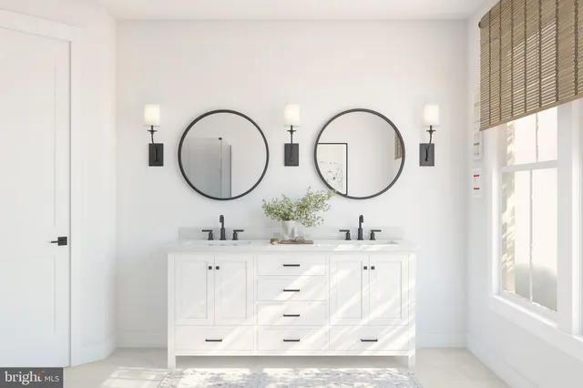 a bathroom with a double vanity sink mirror and a window