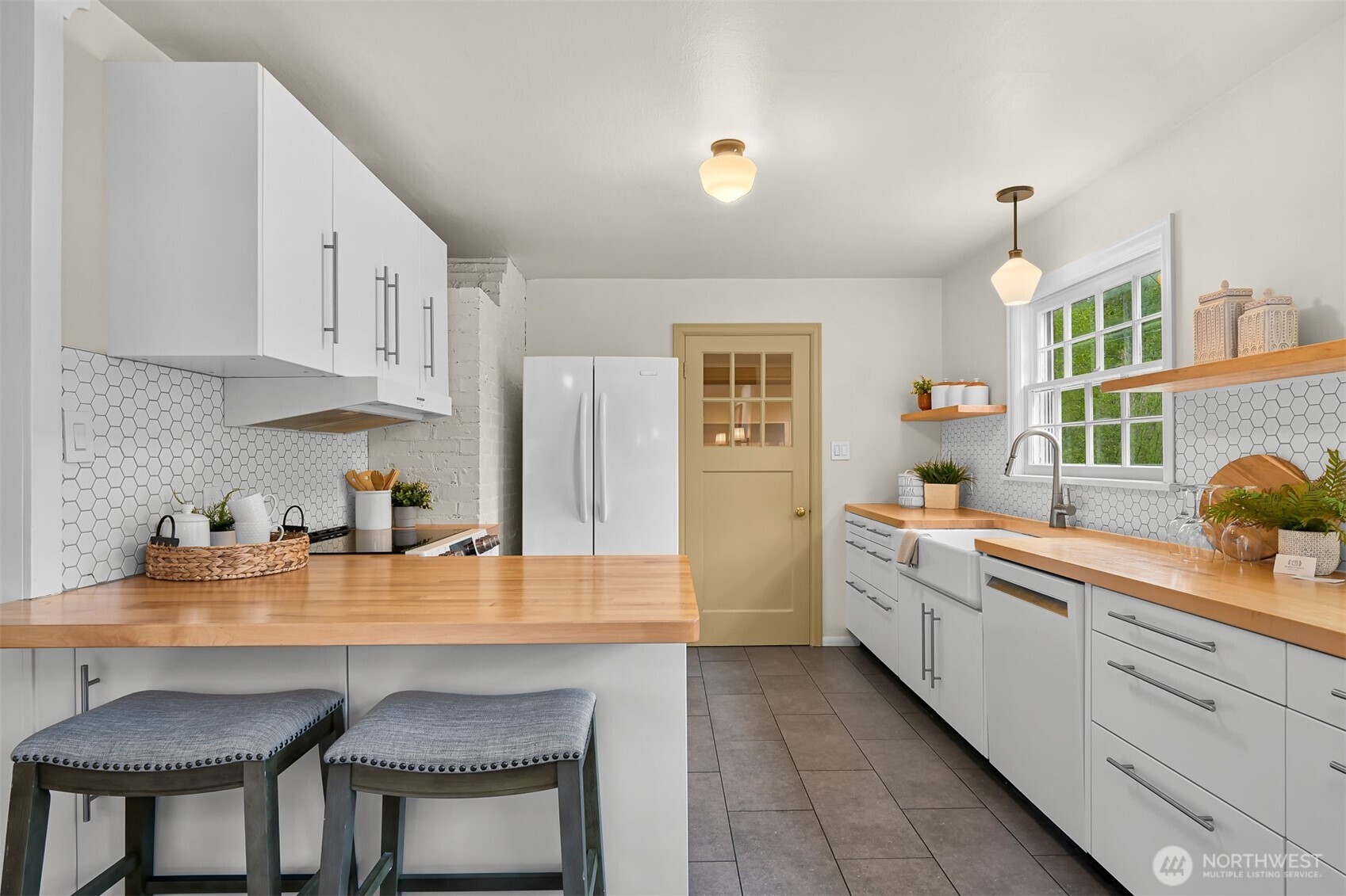 2814 40th Street Bellingham, WA 98229 - Photo 15 of 39 a kitchen with white cabinets and sink