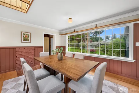 a view of a dining room with furniture window and outside view