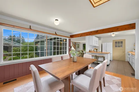 a view of a dining room with furniture window and outside view
