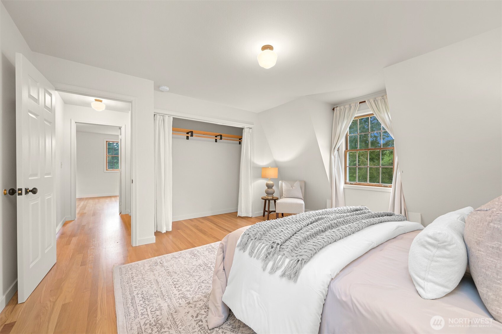 2814 40th Street Bellingham, WA 98229 - Photo 23 of 39 a bedroom with a bed and wooden floor