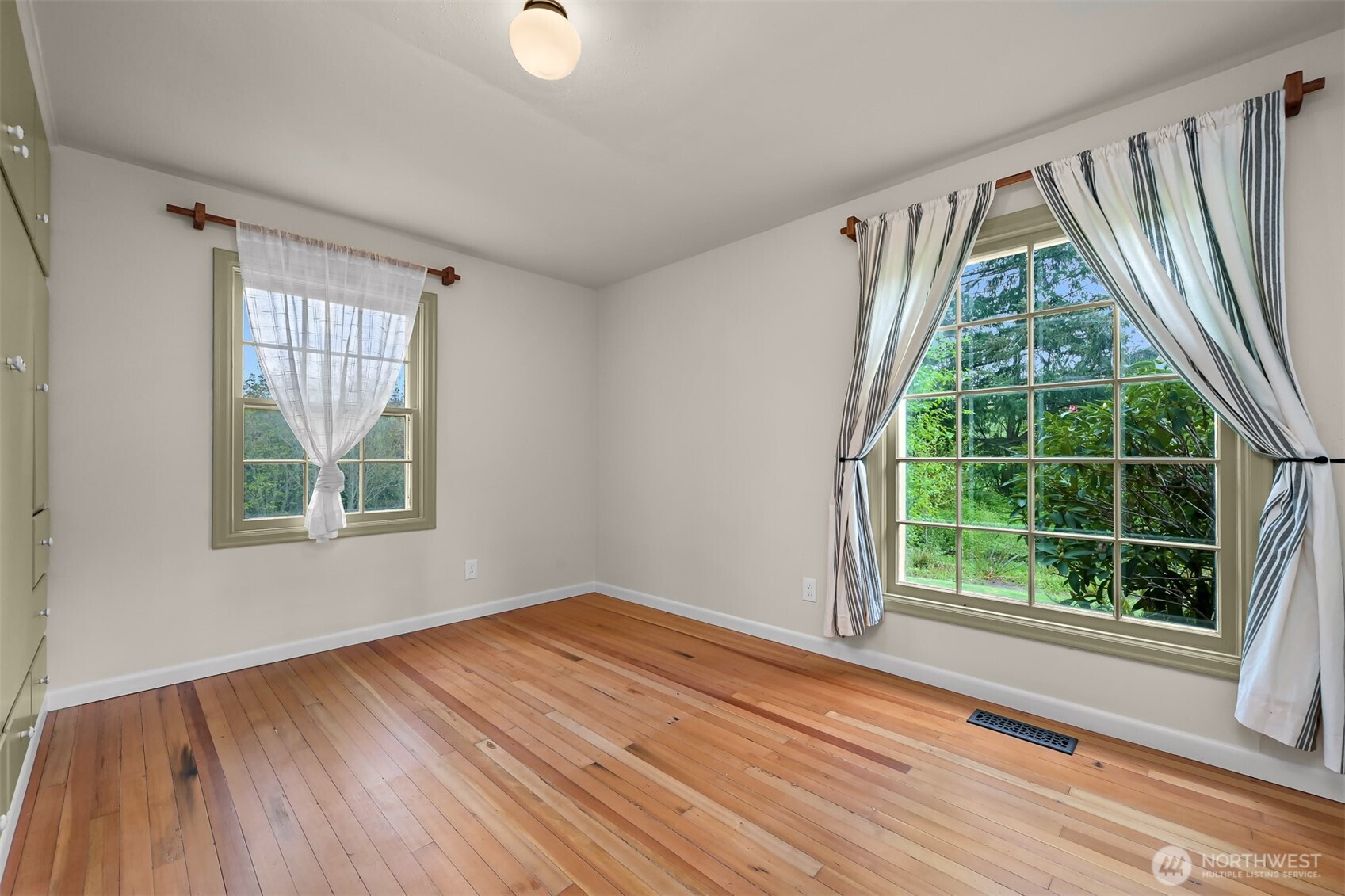 2814 40th Street Bellingham, WA 98229 - Photo 30 of 39 a view of an empty room with wooden floor and a window