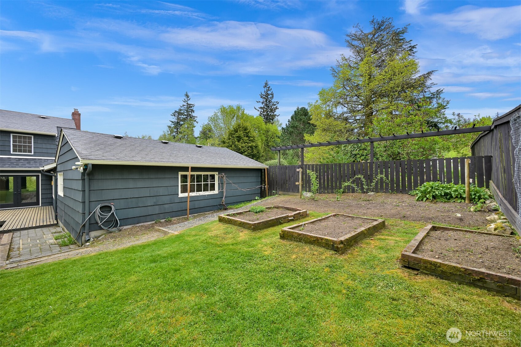 2814 40th Street Bellingham, WA 98229 - Photo 35 of 39 a view of a house with backyard and sitting area