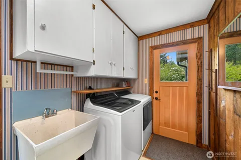 a kitchen that has a sink and a stove