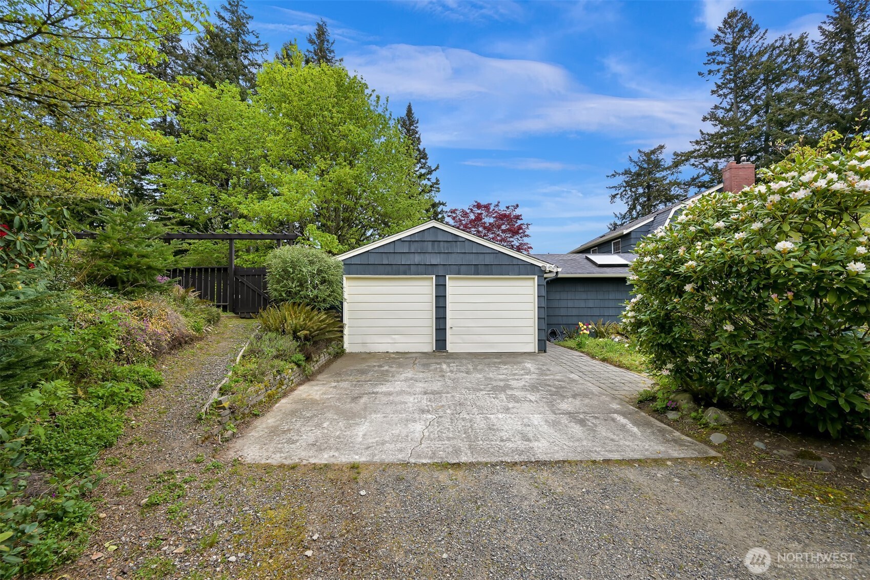 2814 40th Street Bellingham, WA 98229 - Photo 37 of 39 a front view of a house with a yard and garage