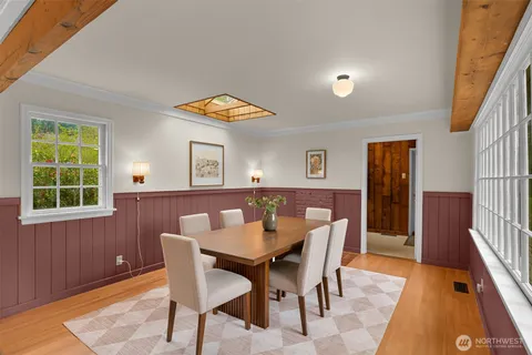 a view of a dining room with furniture and window