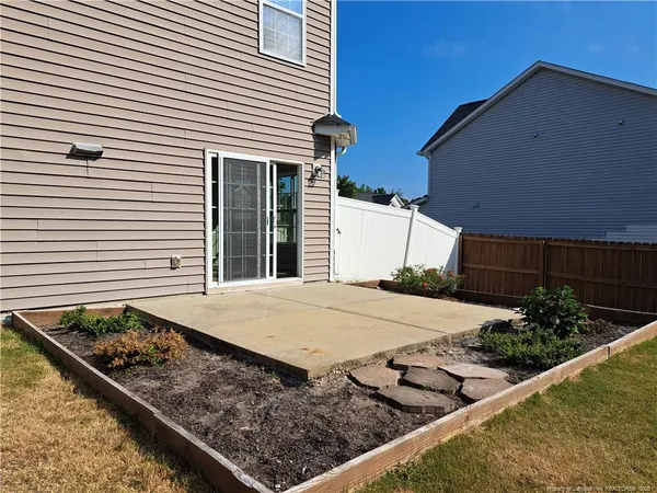 a view of a backyard of the house