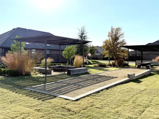 a view of swimming pool with a lounge chairs