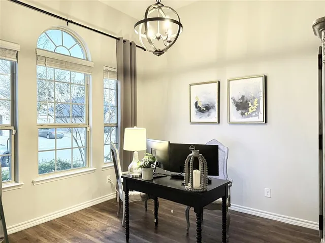 a workspace with furniture window and wooden floor