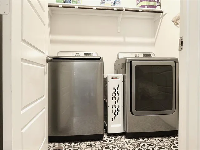 a close view of a utility room with washer and dryer