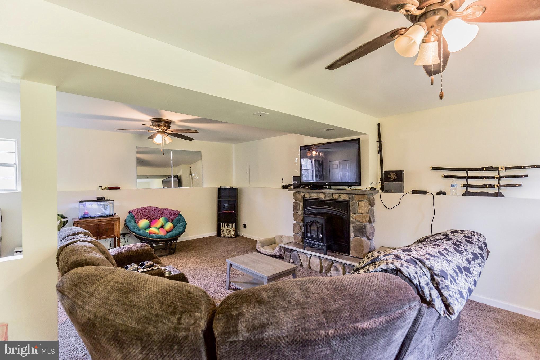3885 St Leonard Road St. Leonard, MD 20685 - Photo 11 of 27 Oversize Family Room With Decorative Fireplace