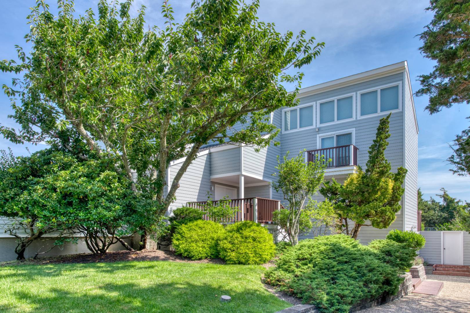 front view of a house with a yard