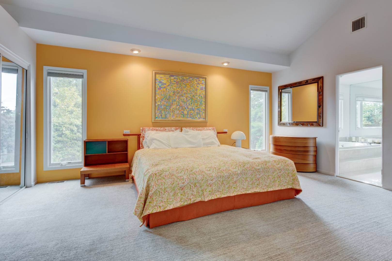 32 Reynolds Drive Westhampton Beach, NY 11978 - Photo 14 of 17 a bedroom with a bed and large windows