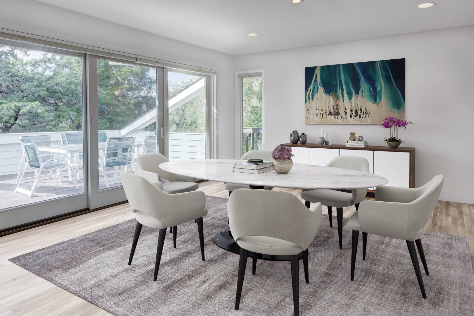 32 Reynolds Drive Westhampton Beach, NY 11978 - Photo 4 of 17 a dining room with furniture a rug and a floor to ceiling window