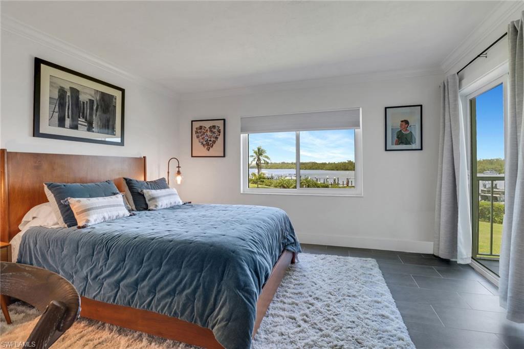 309 Goodlette-Frank Road, Unit 304A Naples, FL 34102 - Photo 8 of 10 Primary bedroom with views of the Gordon River and opening to lanai