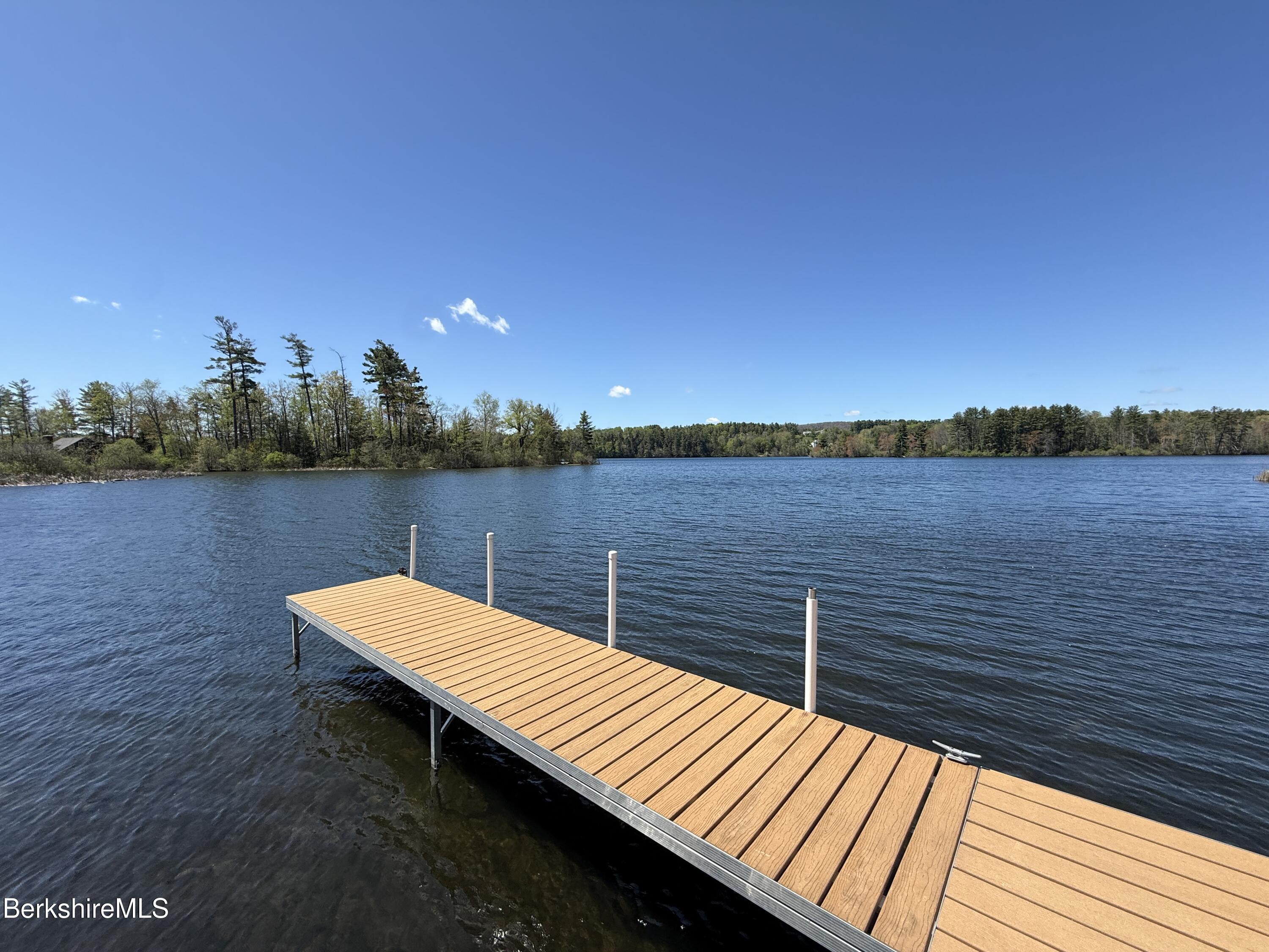 286 Lee Road Lenox, MA 01240 - Photo 2 of 26 a view of a lake with sitting area