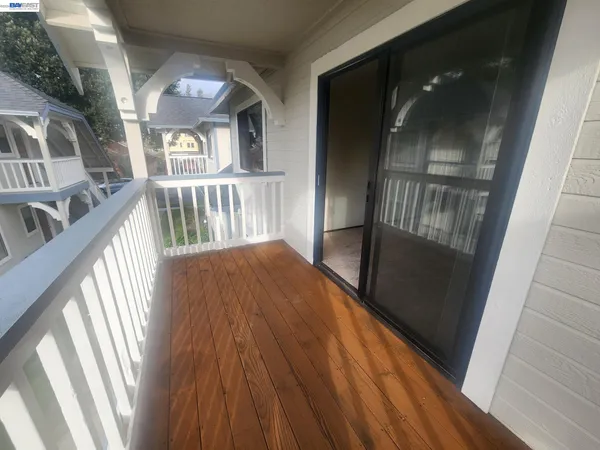 a view of an entryway with wooden floor and door