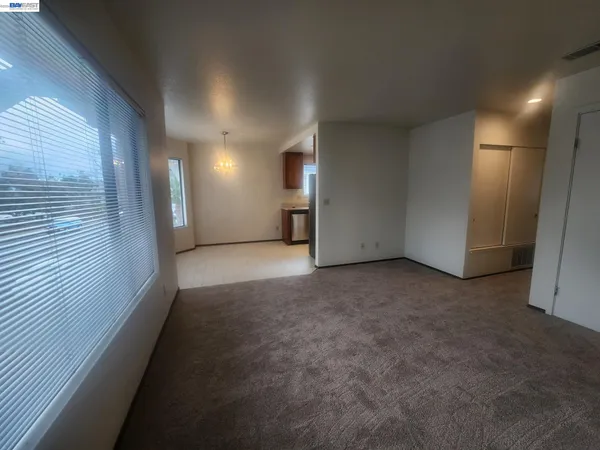 a view of a hallway with staircase