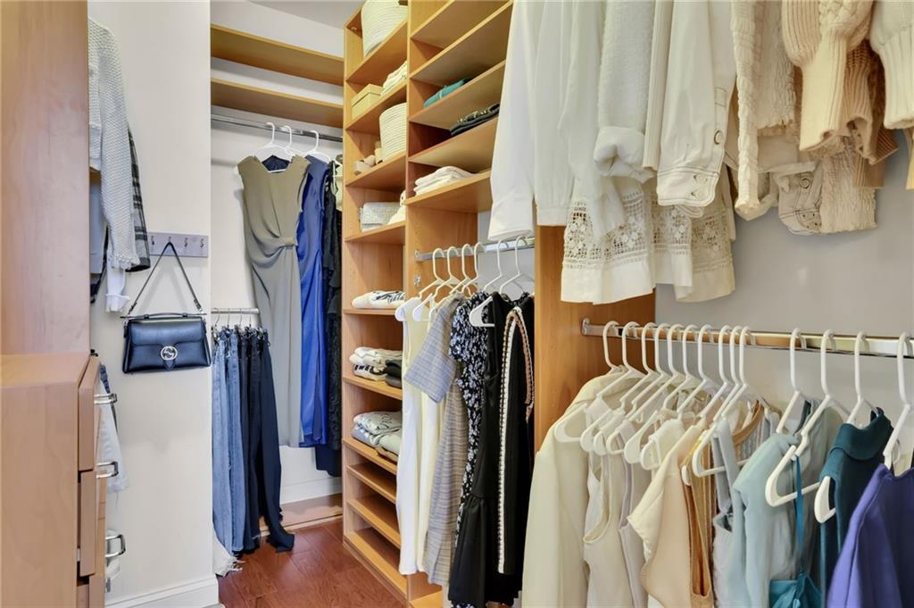 2828 Peachtree Road Northwest, Unit 1901 Atlanta, GA 30305 - Photo 19 of 35 a view of walk in closet with clothes and shoes