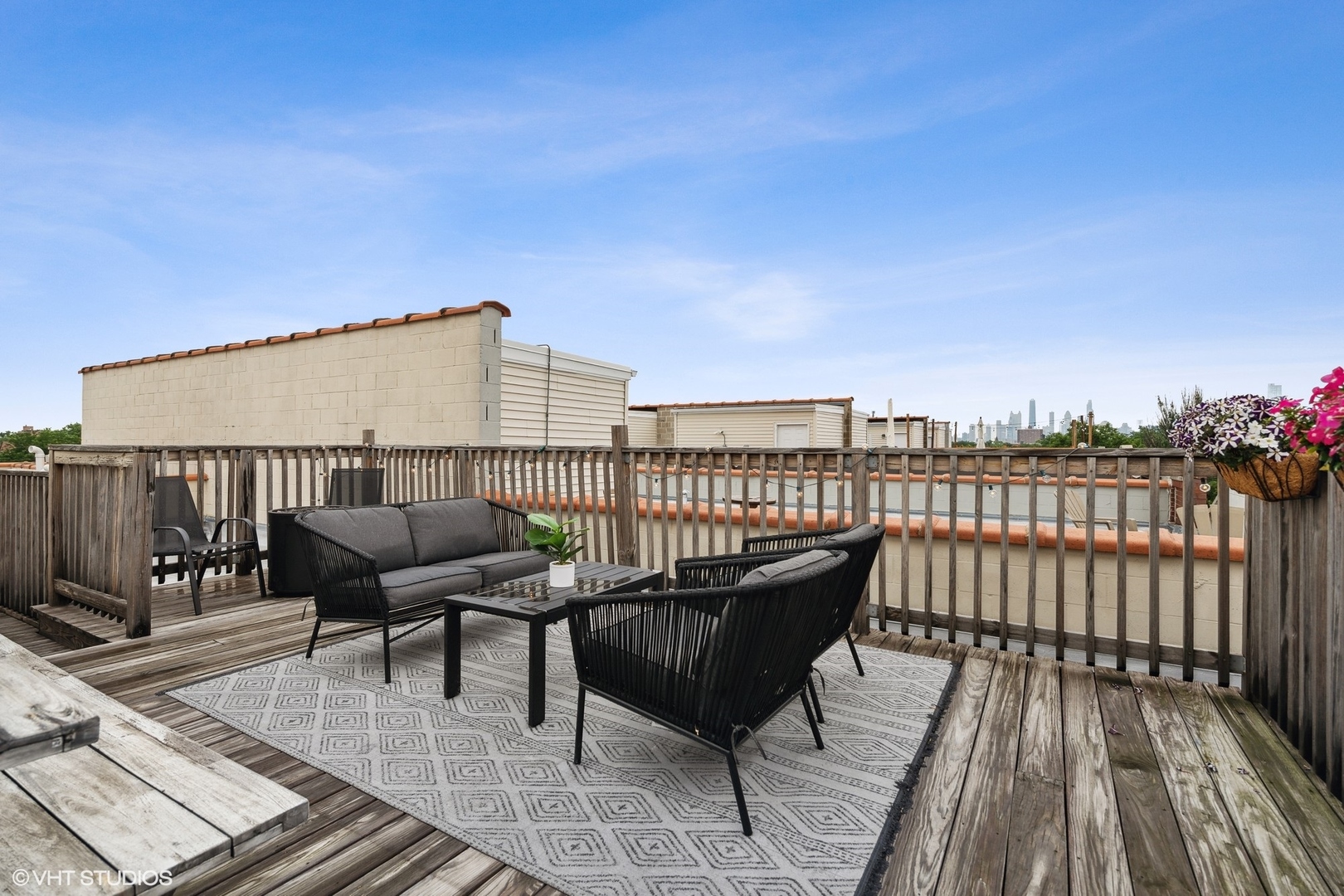 2128 West Rice Street, Unit 4 Chicago, IL 60622 - Photo 19 of 20 a roof deck with a table and chairs