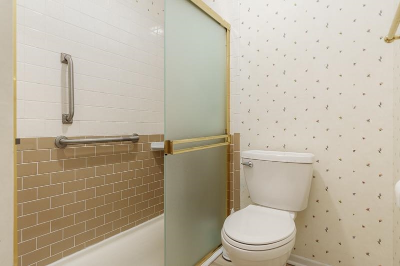 5792 Haddon Place Rockford, IL 61114 - Photo 31 of 47 a white toilet sitting next to a bathroom sink
