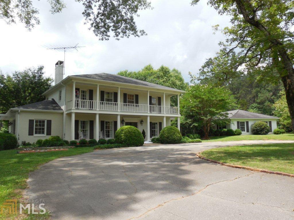930 County Line Road Griffin, GA 30224 - Photo 1 of 1 a front view of a house with a garden