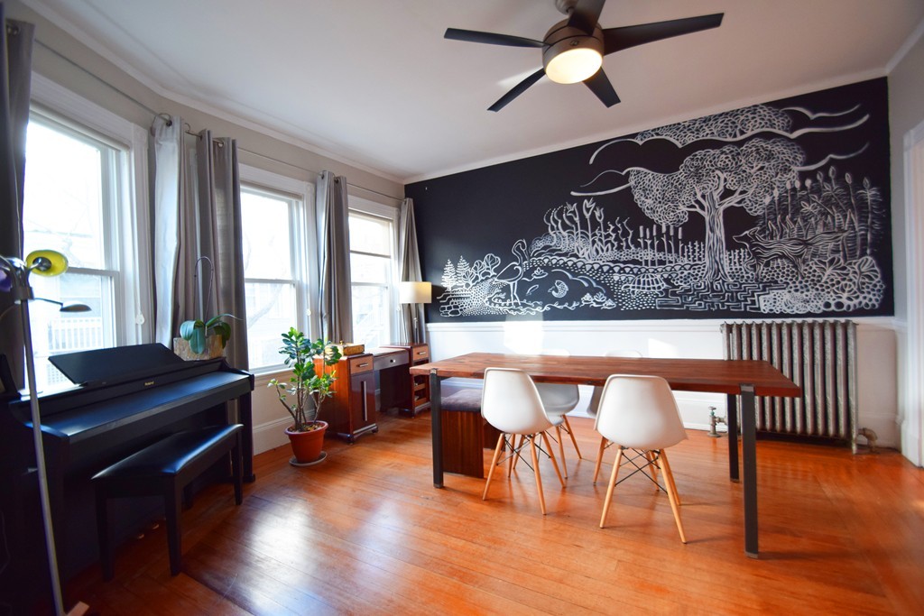 30 Stanton Road, Unit 2 Brookline, MA 02445 - Photo 20 of 21 a dining room with a wooden table and chairs