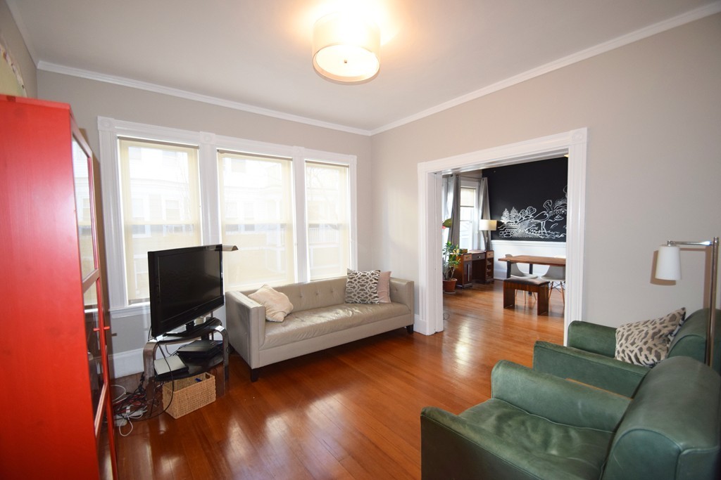 30 Stanton Road, Unit 2 Brookline, MA 02445 - Photo 9 of 21 a living room with furniture and a flat screen tv