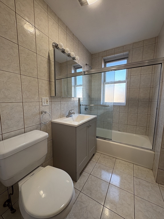 73 Thatcher Street, Unit 301 Brookline, MA 02446 - Photo 13 of 15 a bathroom with a toilet a sink and bathtub