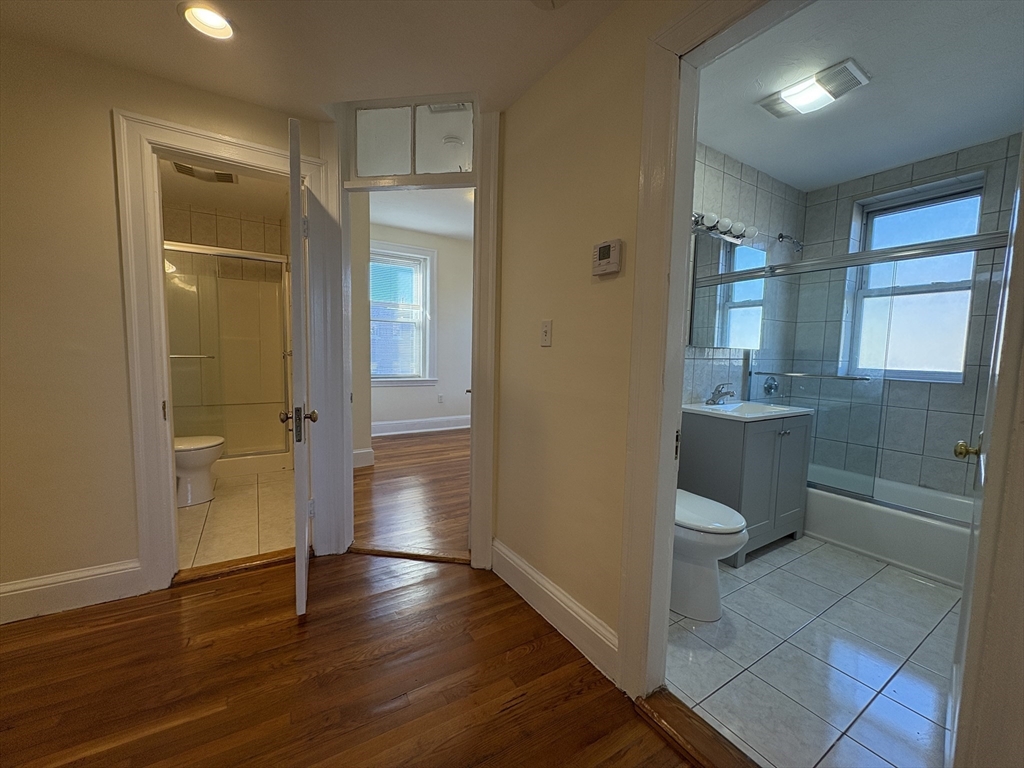 73 Thatcher Street, Unit 301 Brookline, MA 02446 - Photo 15 of 15 a bathroom with a sink toilet and shower
