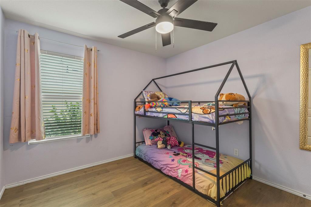 217 Anvil Drive Haslet, TX 76052 - Photo 13 of 18 a bedroom with bunk bed and a window