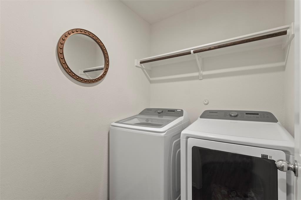 217 Anvil Drive Haslet, TX 76052 - Photo 14 of 18 a utility room with dryer and washer