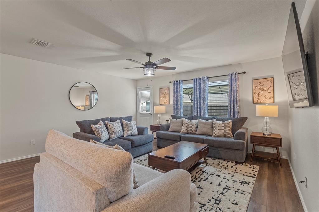 217 Anvil Drive Haslet, TX 76052 - Photo 4 of 18 a living room with furniture a rug and a window