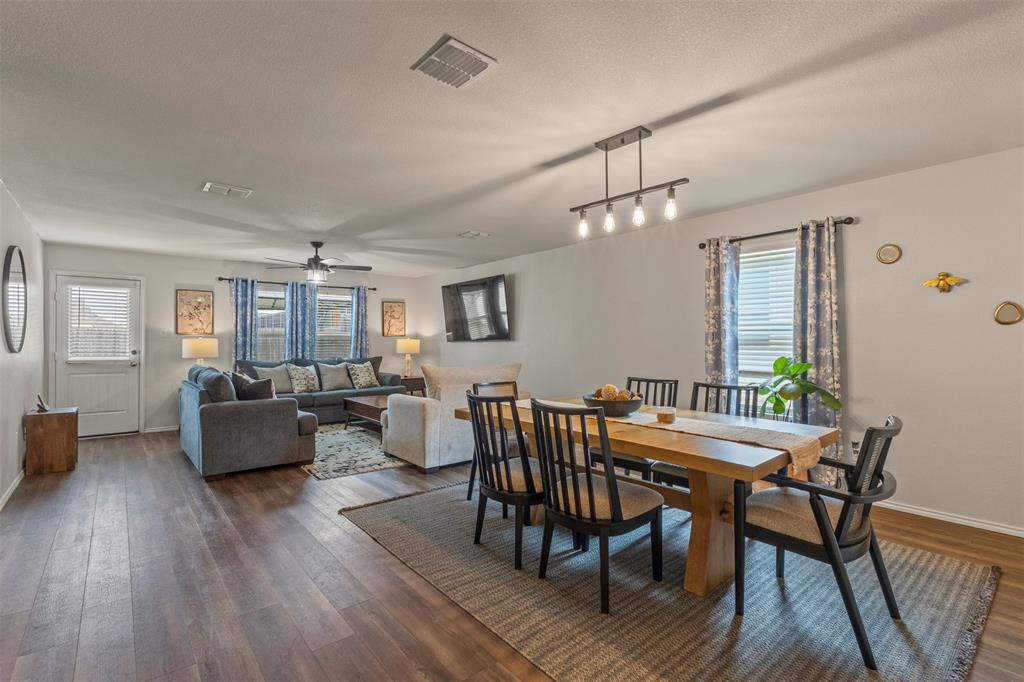 217 Anvil Drive Haslet, TX 76052 - Photo 5 of 18 a dining room with furniture wooden floor and a rug