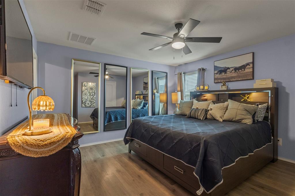 217 Anvil Drive Haslet, TX 76052 - Photo 9 of 18 a bedroom with a bed and mirror