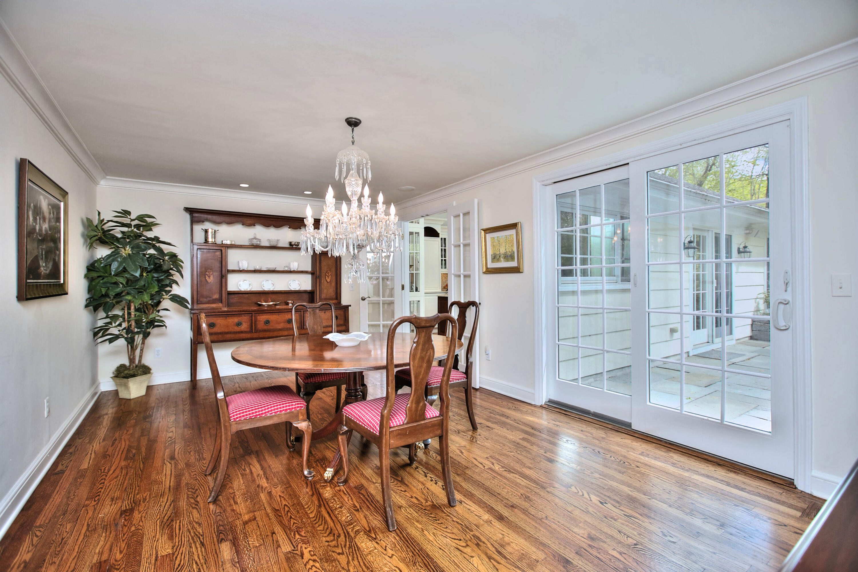 229 Smith Ridge Road New Canaan, CT 06840 - Photo 11 of 28 a view of a dining room with furniture window and wooden floor