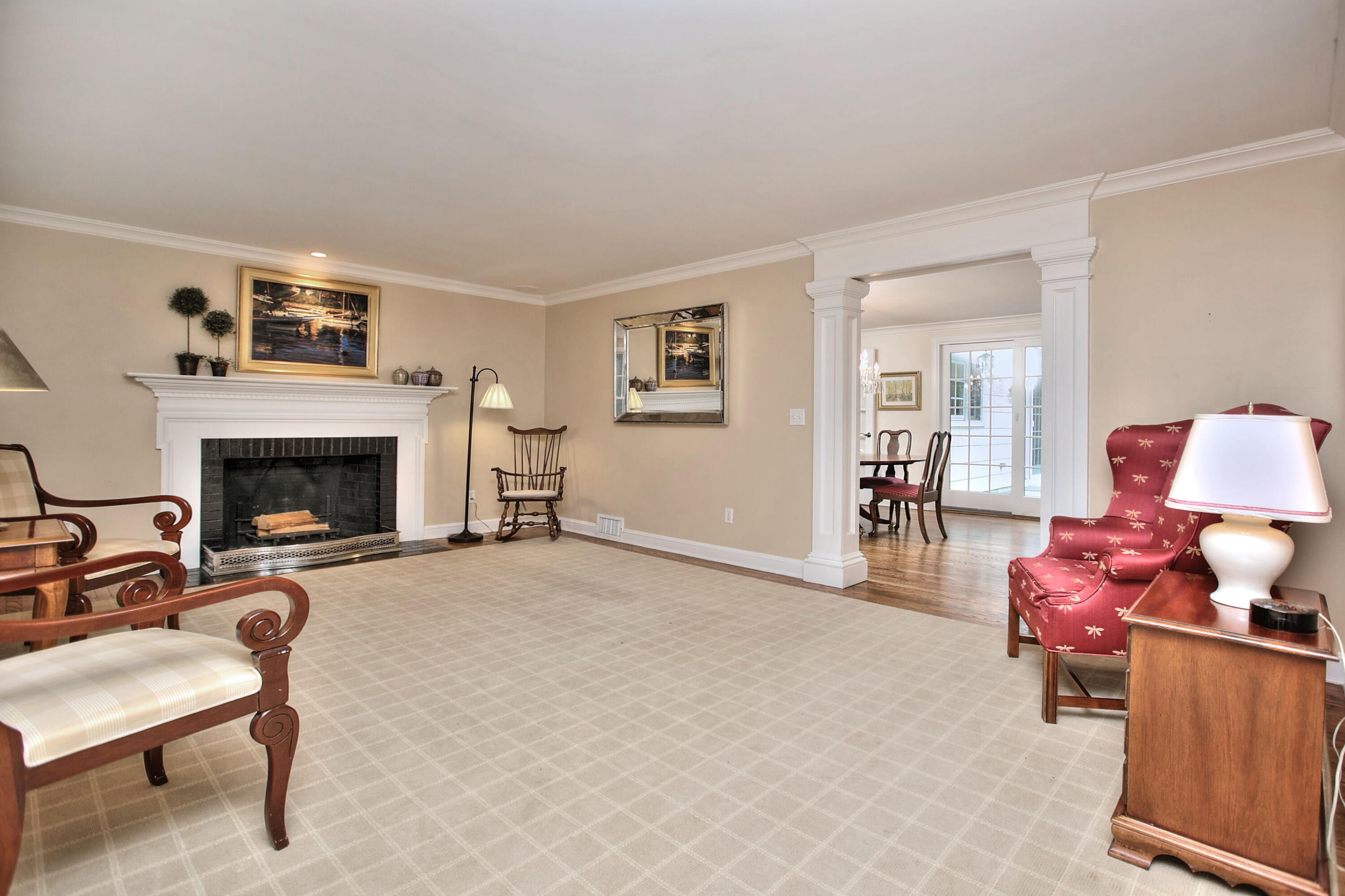 229 Smith Ridge Road New Canaan, CT 06840 - Photo 15 of 28 a living room with furniture and a fireplace