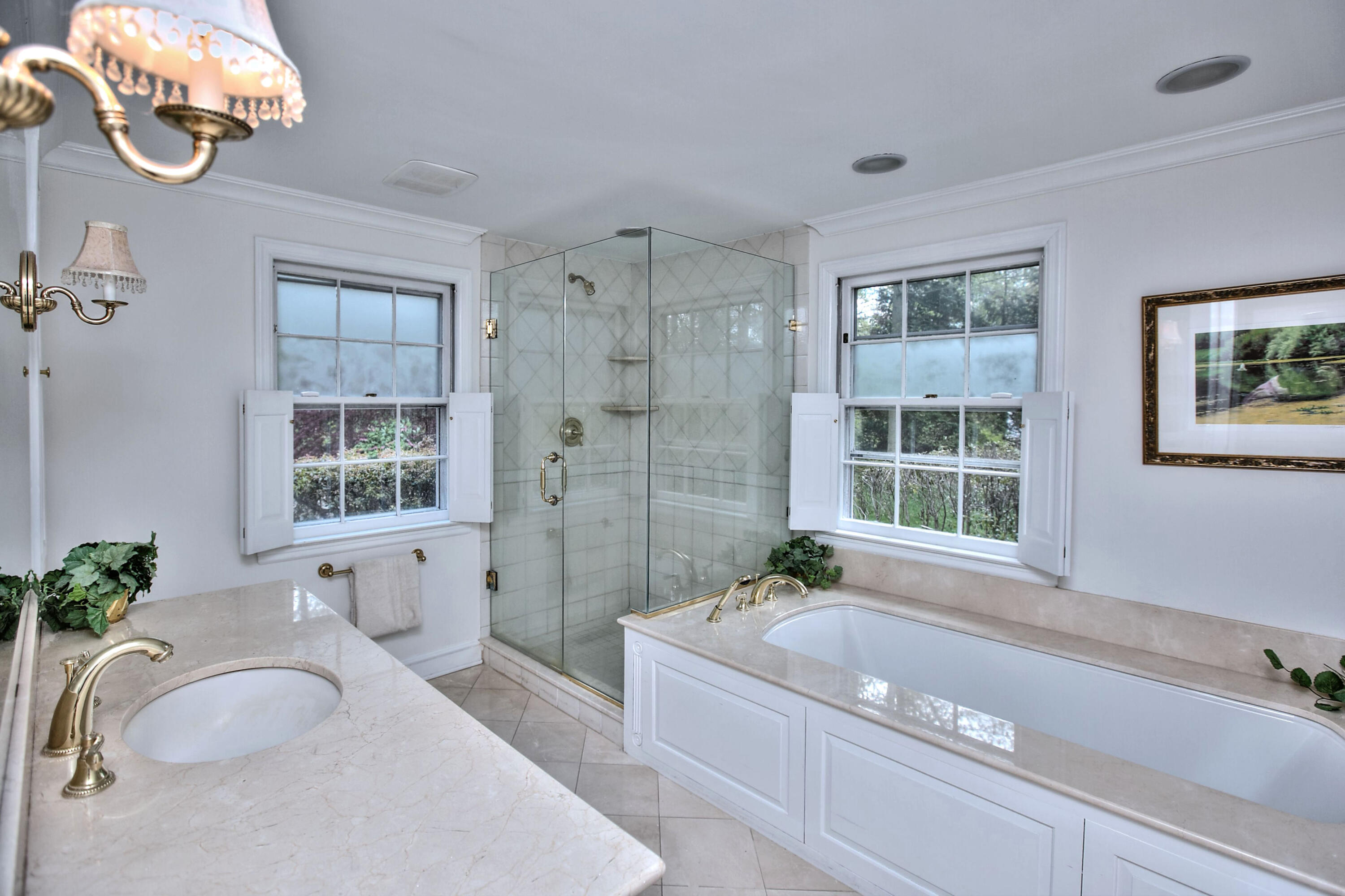 229 Smith Ridge Road New Canaan, CT 06840 - Photo 19 of 28 a bathroom with a granite countertop tub a sink and a large mirror