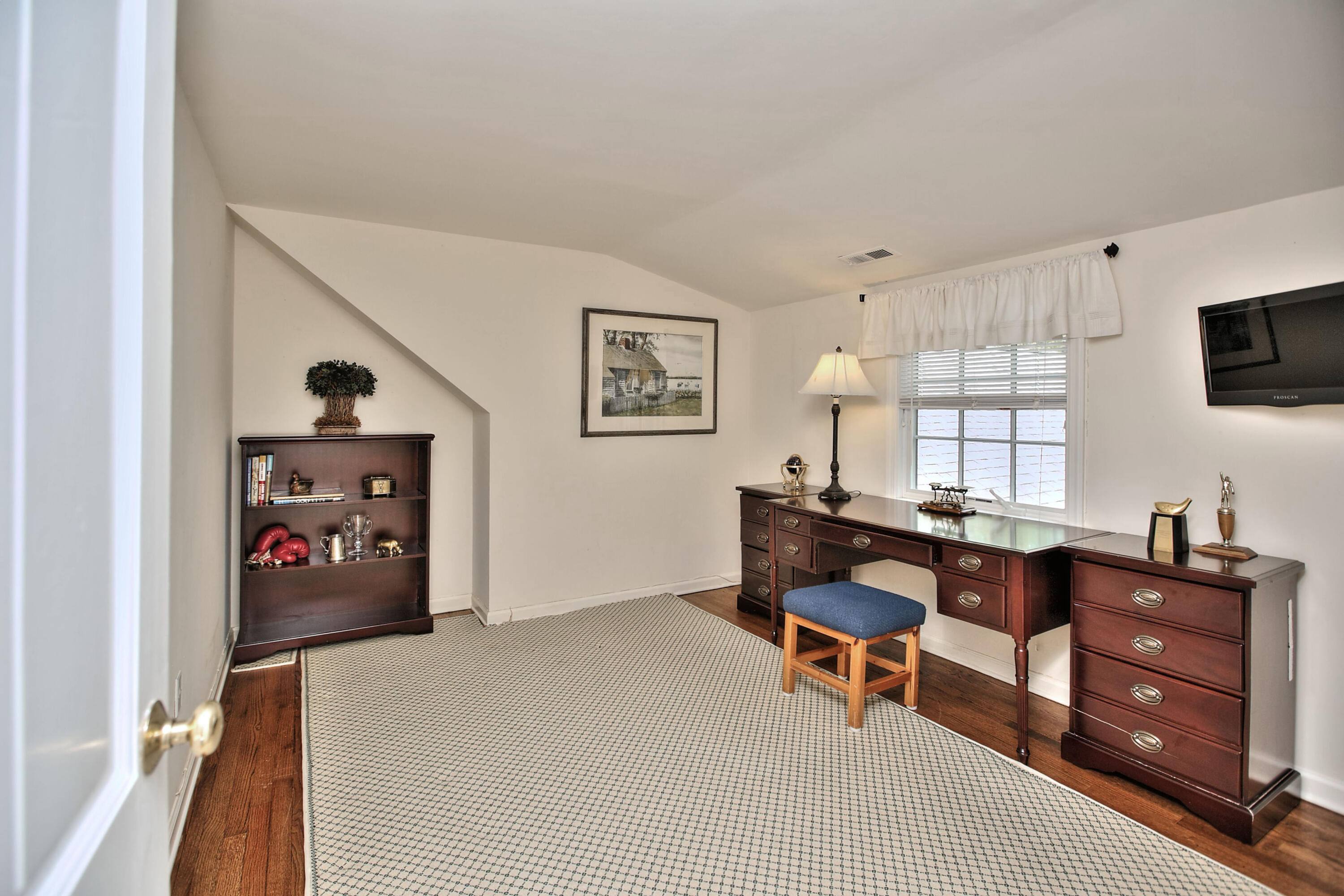 229 Smith Ridge Road New Canaan, CT 06840 - Photo 23 of 28 a living room with furniture and a flat screen tv
