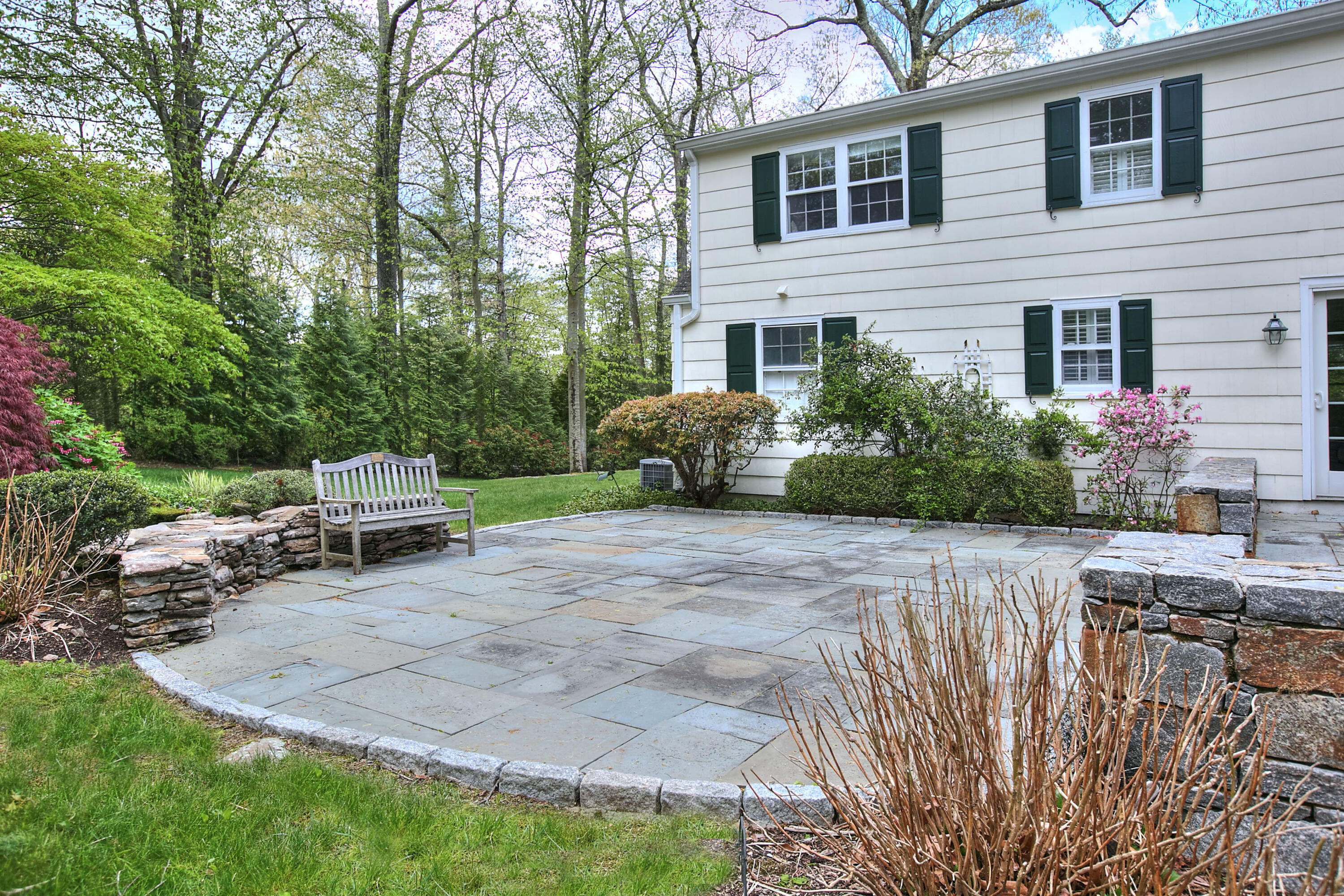 229 Smith Ridge Road New Canaan, CT 06840 - Photo 25 of 28 a view of a backyard with sitting area and slide