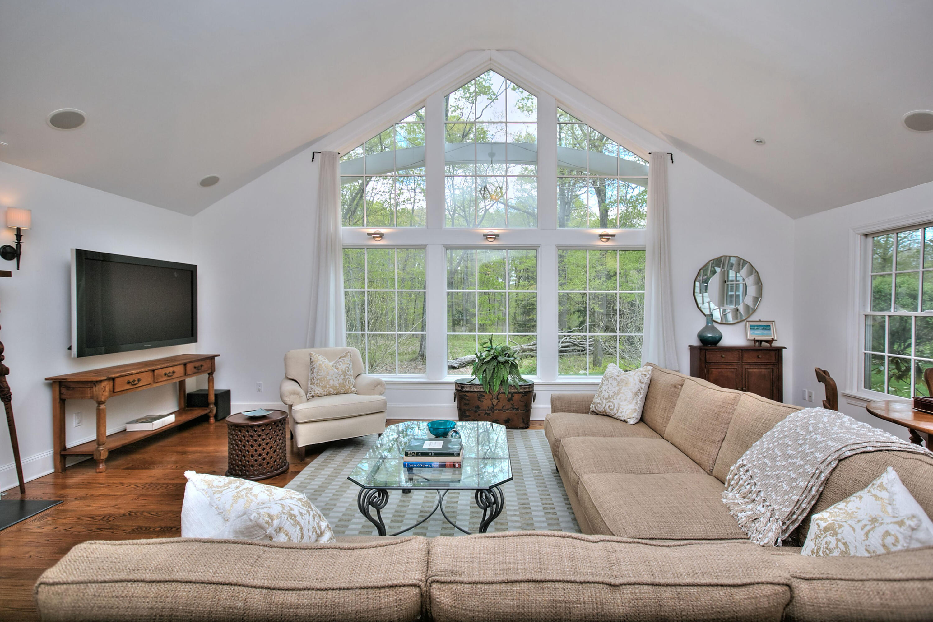 229 Smith Ridge Road New Canaan, CT 06840 - Photo 4 of 28 a living room with furniture large window and a flat screen tv