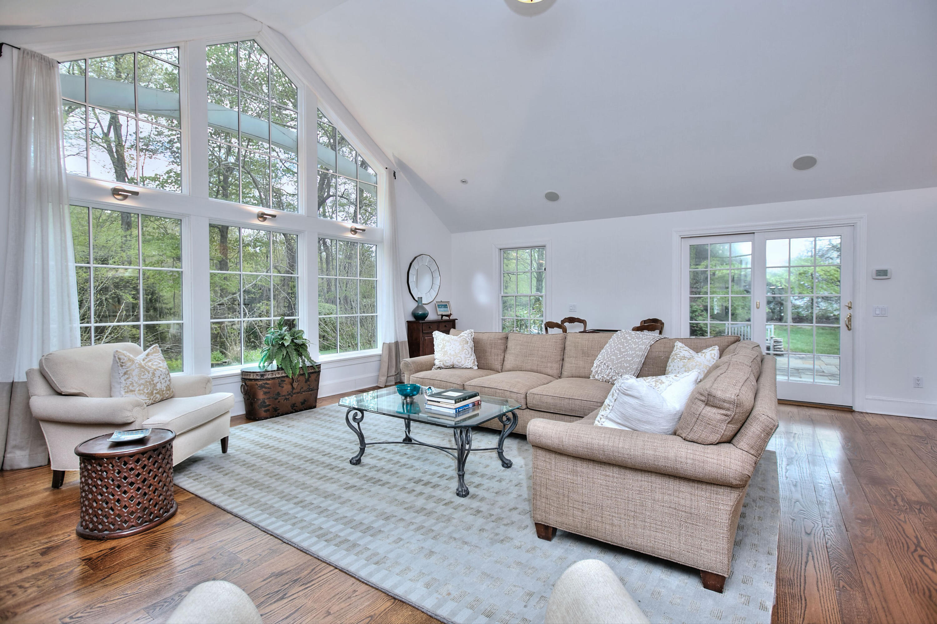 229 Smith Ridge Road New Canaan, CT 06840 - Photo 5 of 28 a living room with furniture and a large window