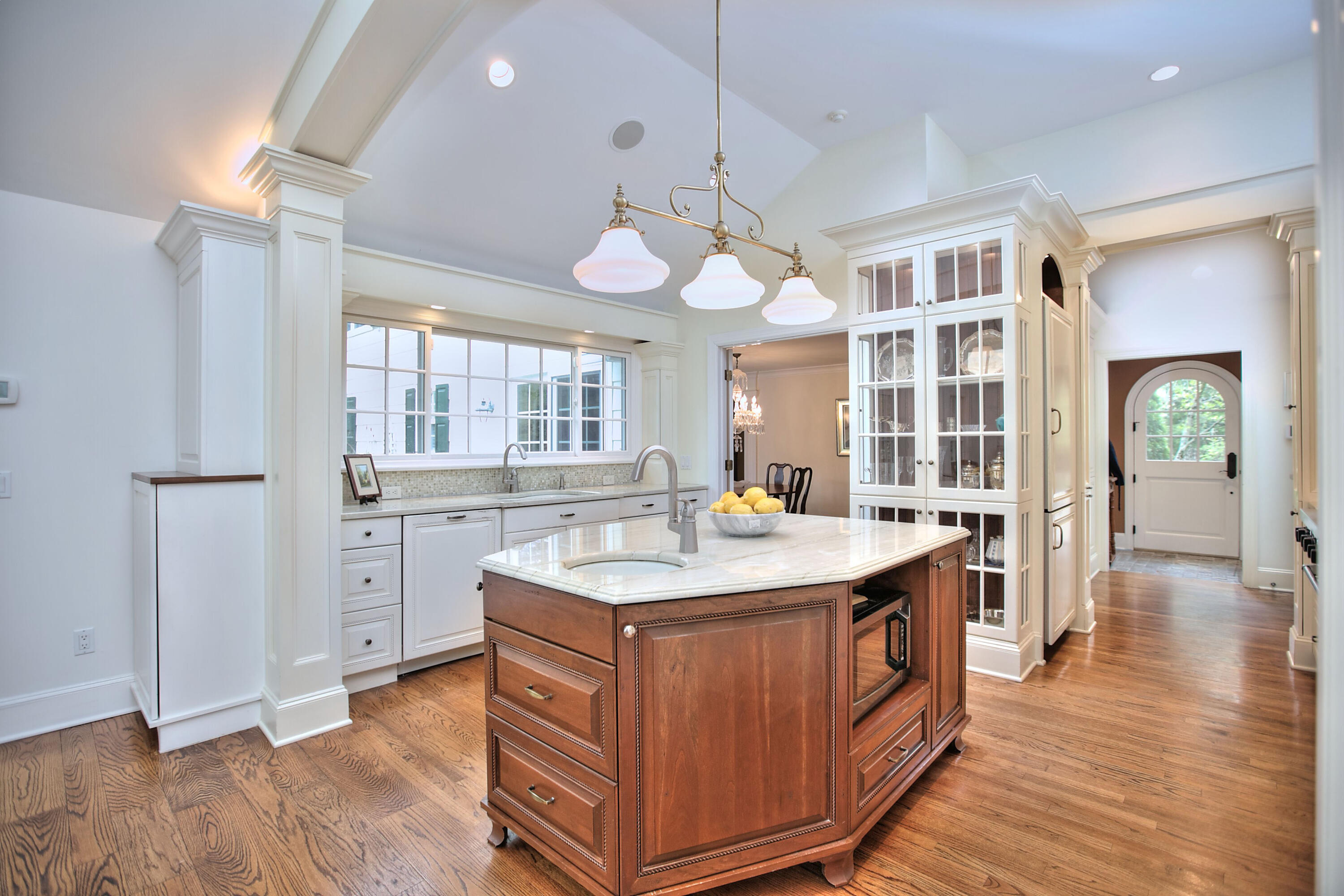 229 Smith Ridge Road New Canaan, CT 06840 - Photo 8 of 28 a kitchen with a stove a sink dishwasher and a refrigerator with wooden floor