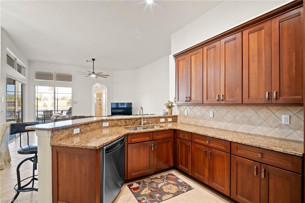 19415 La Serena Drive Estero, FL 33967 - Photo 13 of 49 a kitchen with a sink stove and cabinets