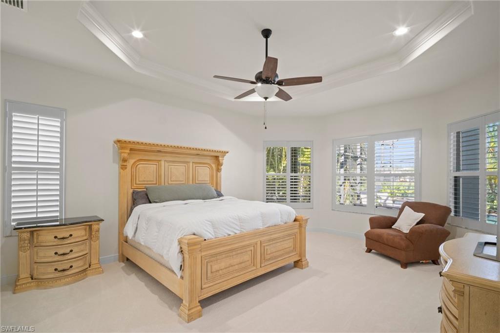 19415 La Serena Drive Estero, FL 33967 - Photo 16 of 49 a bedroom with a bed and furniture with window