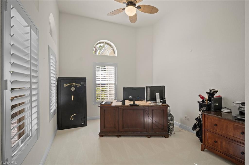 19415 La Serena Drive Estero, FL 33967 - Photo 21 of 49 a bedroom with a bed and a chandelier