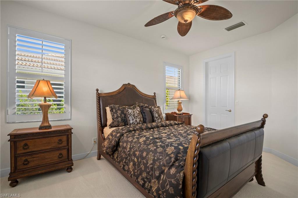 19415 La Serena Drive Estero, FL 33967 - Photo 24 of 49 a bedroom with a bed and a dresser