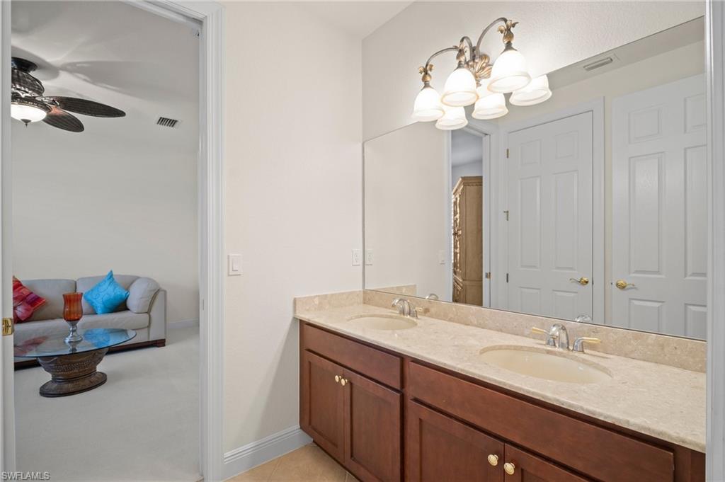 19415 La Serena Drive Estero, FL 33967 - Photo 27 of 49 a bathroom with a sink and a mirror